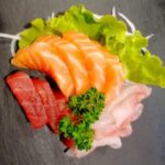 Sashimi misto di salmone, branzino e tonno, otto pezzi. MASSIMO UNO PER MENU’